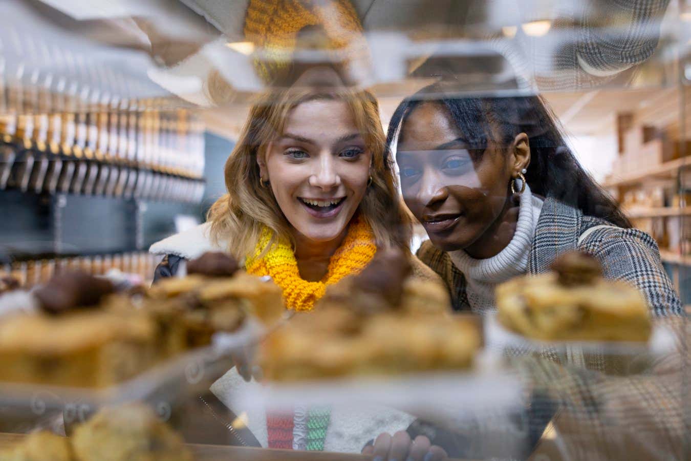 Two women choosing food in a cafe