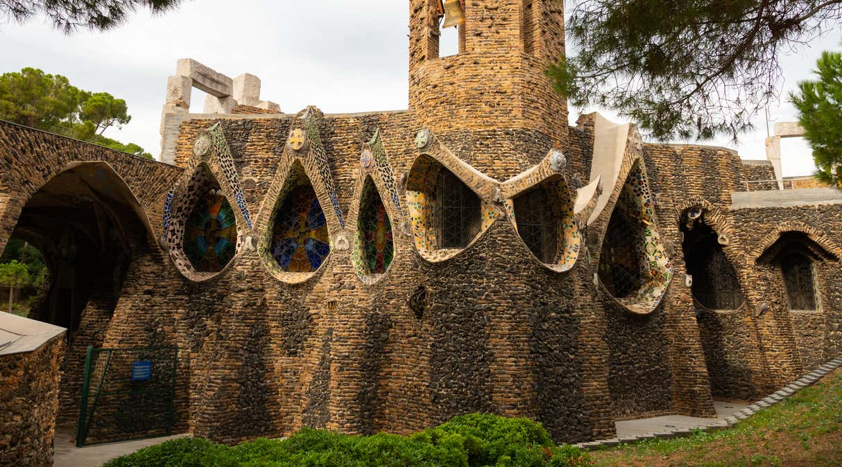 Exterior view of guell crypt, a masterpiece gaudi architecture located at catalunya outside town, Spain