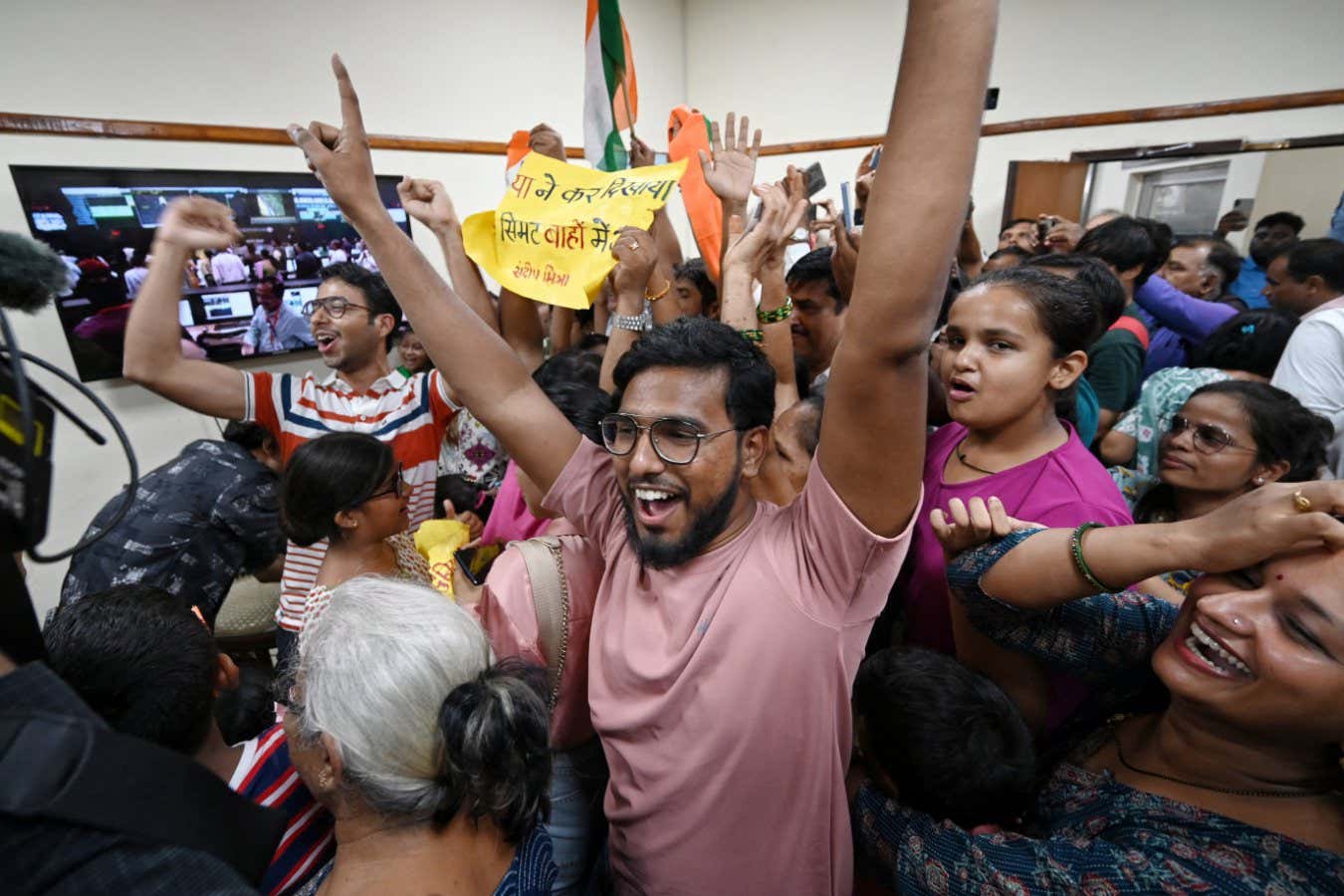 NEW DELHI, INDIA - AUGUST 23: People celebrates after successful landing of Chandrayaan 3 on Moon at Nehru Planetarium on August 23, 2023 in New Delhi, India. The Chandrayaan-3 lander module has successfully touched down on the Moon's south pole, making India the first nation in the world to achieve this feat. India is also the fourth nation, after the United States, China and Russia to have landed on the Moon. (Photo by Sanchit Khanna/Hindustan Times via Getty Images)