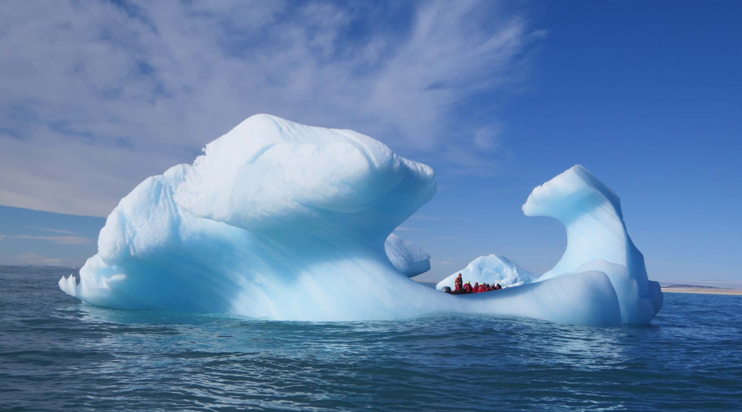 Stunning iceberg with Zodiac in distance, Spitsbergen, Arctic