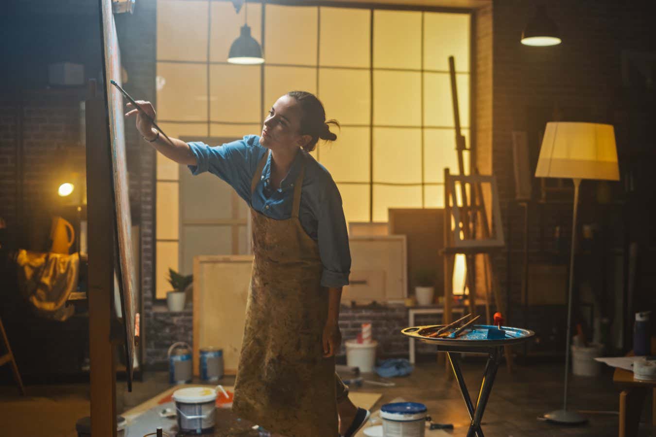 Female Artist Drawing with Paint Brush Energetically, Enthusiastically Talented Female Artist Drawing with Paint Brush Energetically Enthusiastically, She Creates Modern Masterpiece of Oil Painting. ; Shutterstock ID 1540650212; purchase_order: -; job: -; client: -; other: -