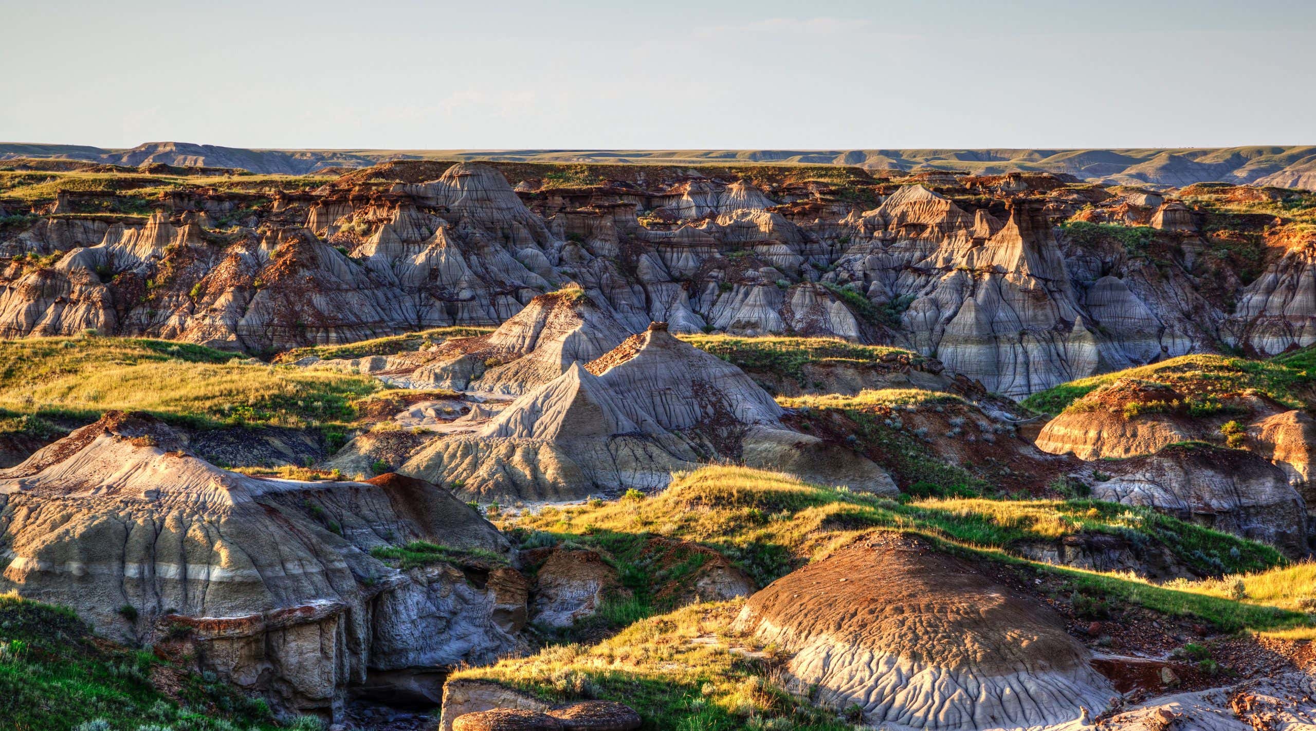 Sun setting over Dinosaur Provincial Park, a UNESCO World Heritage Site in Alberta, Canada. The Alberta badlands is well known for being one of the richest dinosaur fossil locales in the world.