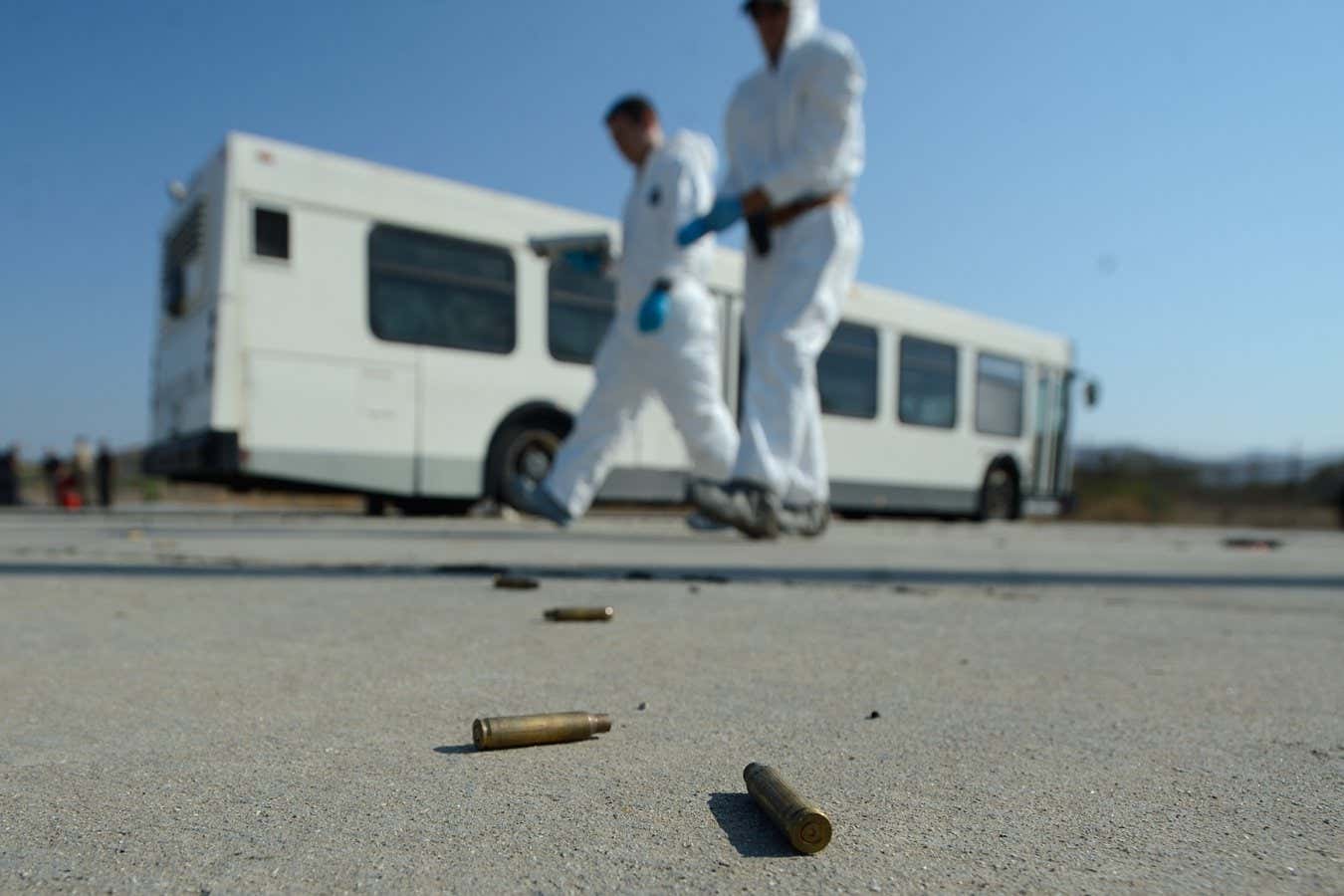 Bullet shells on the ground as members of the FBI practice their investigation techniques