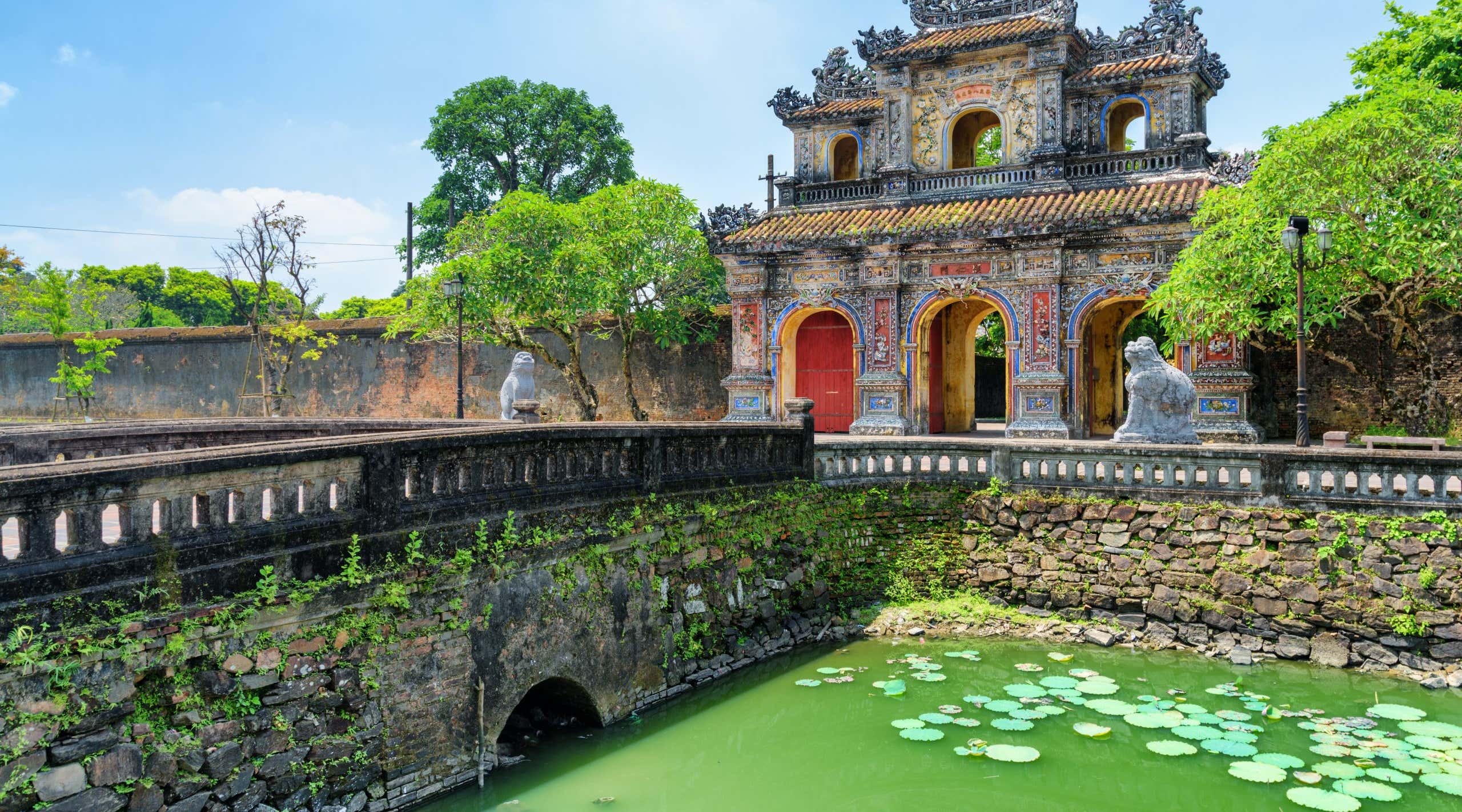 Wonderful view of the East Gate (Hien Nhon Gate) to the Citadel and a moat surrounding the Imperial City with the Purple Forbidden City in Hue, Vietnam. Hue is a popular tourist destination of Asia.