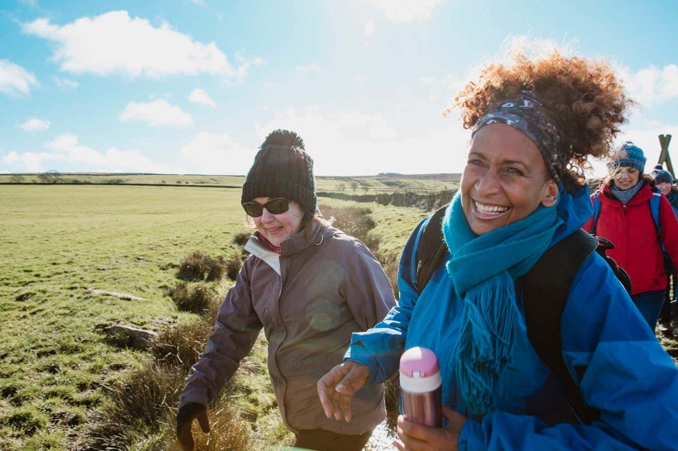 Close up shot of female walkers laughing in the countryside.