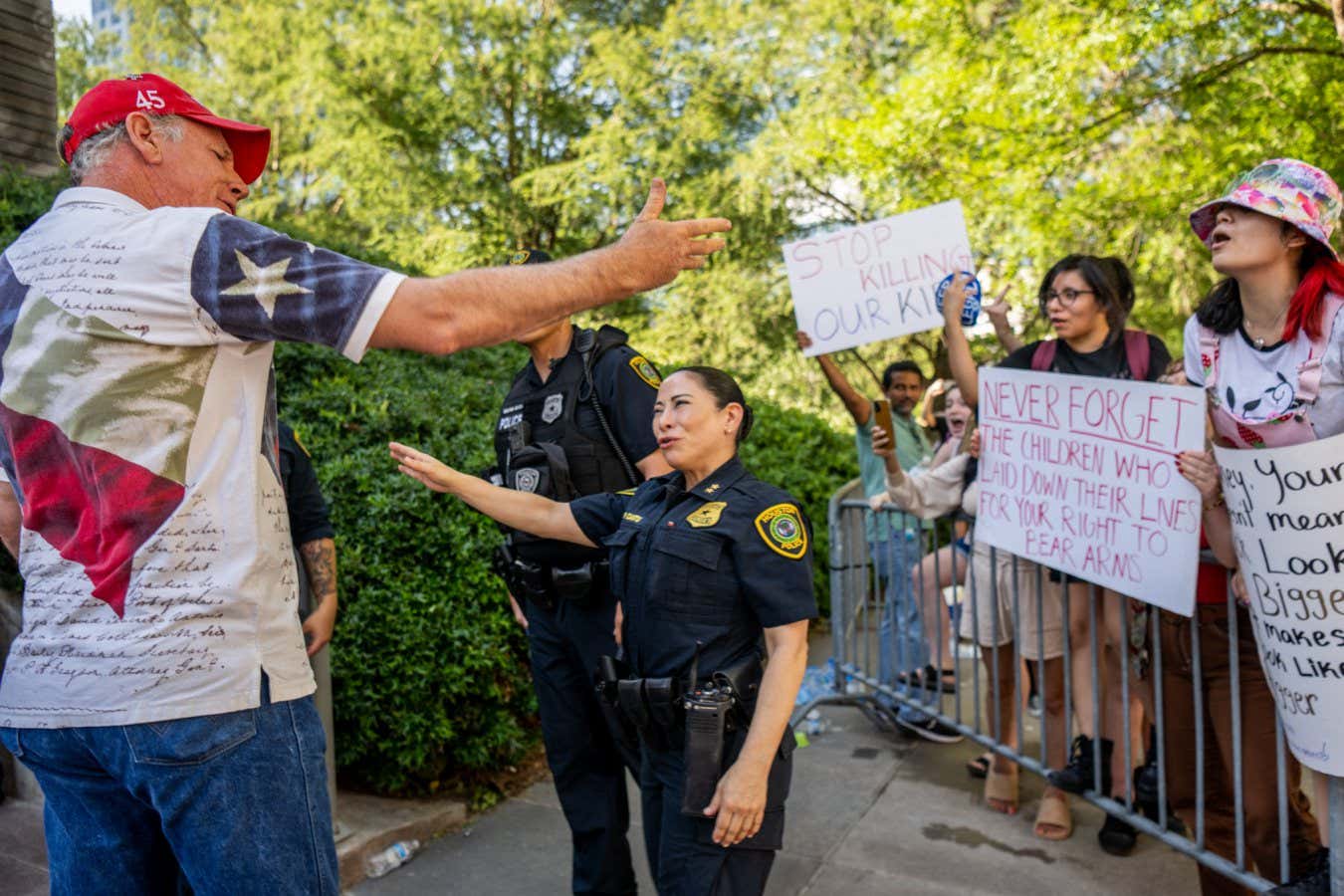 HOUSTON, TEXAS - MAY 28: An attendee of the National Rifle Association (NRA) annual convention argues with gun control advocates outside of the George R. Brown Convention Center on May 28, 2022 in Houston, Texas. The annual National Rifle Association convention comes days after the mass shooting in Uvalde, Texas which left 19 students and 2 adults dead, with the gunman fatally shot by law enforcement officers. (Photo by Brandon Bell/Getty Images)