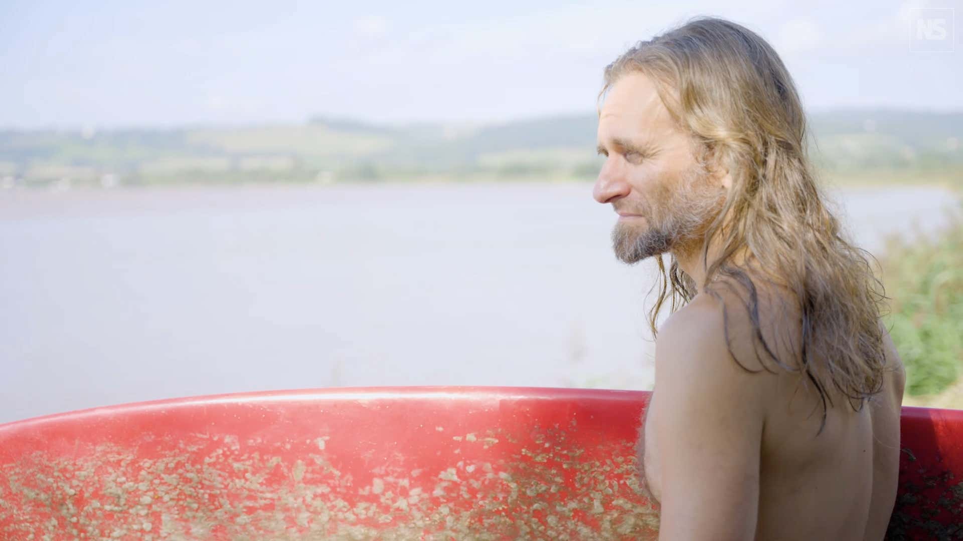 Ben Rogers surfs a tidal bore on the River Severn