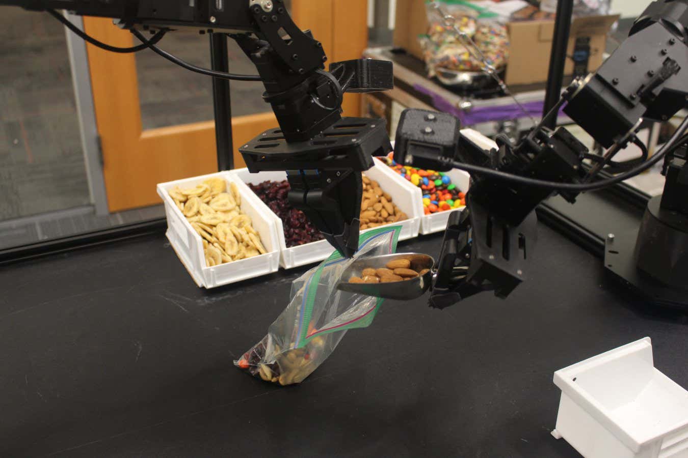 This robot can respond to verbal commands and corrections on the fly.