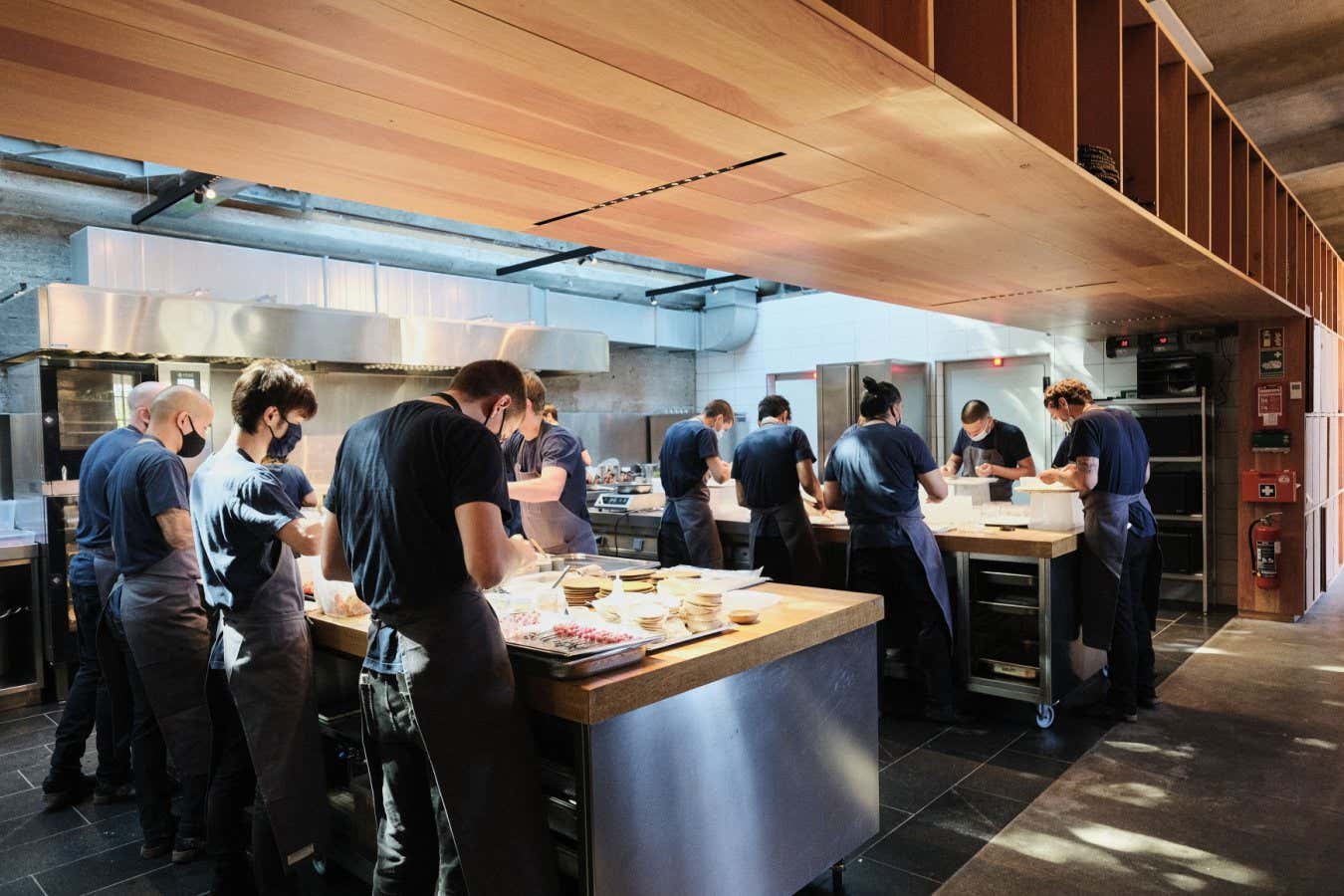 Personnel of the World class Danish restaurant Noma works in the kichten on May 31, 2021 in Copenhagen. - While the six-month Covid-19 closure has been tough for Noma, consistently ranked as one of the world's top restaurants, it's also been an opportunity to reinvent its cuisine. As it reopened this June, the restaurant has reworked its menu -- in part to take the lack of foreign tourists into account. (Photo by Thibault Savary / AFP) (Photo by THIBAULT SAVARY/AFP via Getty Images)