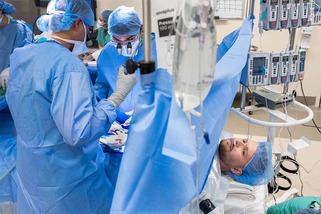 Patient John Nicholas awake in the OR as he undergoes a kidney transplant