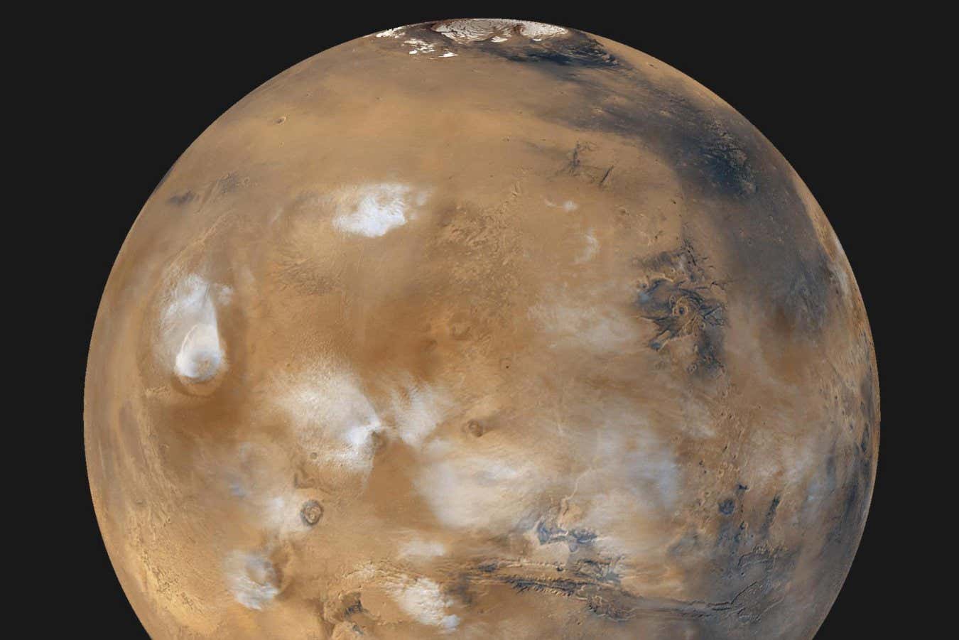 Mars Daily Global Image from April 1999 Twelve orbits a day provide NASA Mars Global Surveyor MOC wide angle cameras a global napshot of weather patterns across the planet. Here, bluish-white water ice clouds hang above the Tharsis volcanoes.
