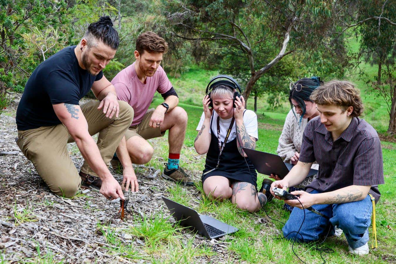 The Flinders ecoacoustics team listening to soil on campus