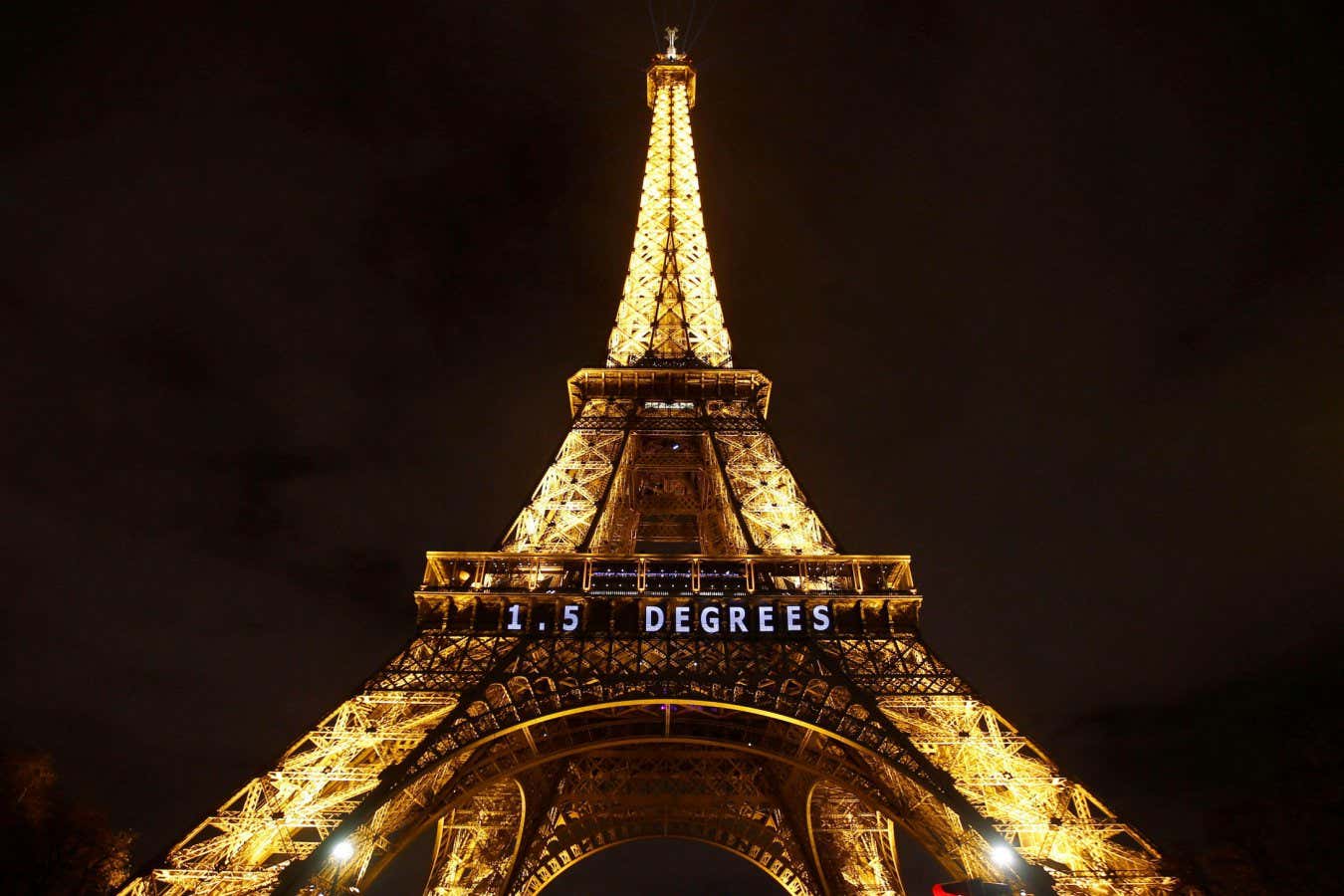 2MJA8ED FILE - In this Dec. 11, 2015, file photo, the slogan 1.5 DEGREES is projected on the Eiffel Tower as part of the COP21, United Nations Climate Change Conference in Paris. Next month's three-day U.N. climate summit will highlight the urgency of taking immediate actions to reduce global warming and focus on innovations that work, not wordy statements, the U.N. special envoy for the event said Tuesday, Aug. 27, 2019. (AP Photo/Francois Mori, File)