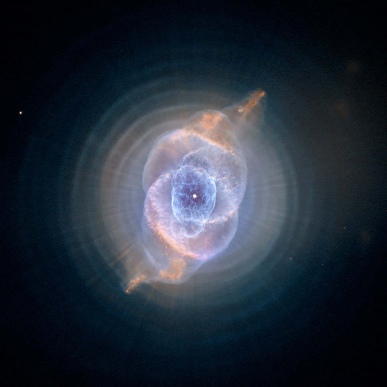 In this detailed view from the NASA/ESA Hubble Space Telescope, the so-called Cat's Eye Nebula looks like the penetrating eye of the disembodied sorcerer Sauron from the film adaptation of "Lord of the Rings." The nebula, formally catalogued NGC 6543, is every bit as inscrutable as the J.R.R. Tolkien phantom character. Although the Cat's Eye Nebula was among the first planetary nebula ever to be discovered, it is one of the most complex planetary nebulae ever seen in space. A planetary nebula forms when Sun-like stars gently eject their outer gaseous layers to form bright nebulae with amazing twisted shapes.