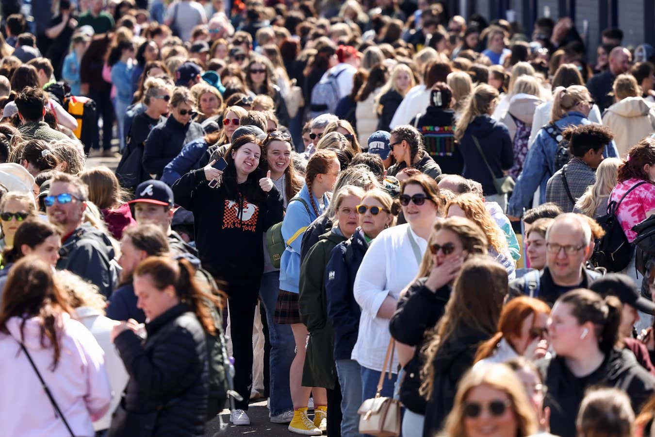 EDINBURGH, SCOTLAND - JUNE 06: Taylor Swift fans queue outside Murrayfield stadium ahead of tomorrow nights concert on June 06, 2024 in Edinburgh, Scotland. Taylor Swift's Eras World Tour plays 15 dates across Scotland, Wales and England this June and August. Her fans, known as Swifties, had made the superstar $200 million in Eras merchandise sales as of November 2023. (Photo by Jeff J Mitchell/Getty Images)