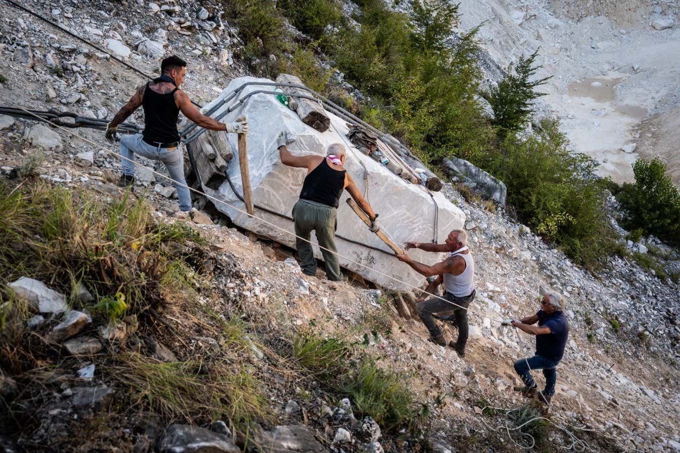 Participants take part in the 'historic lizzatura', a reconstruction of how the very heavy marble blocks were moved from the quarries by hand, using only cables, ropes and lumber to slide them down the mountainsides.