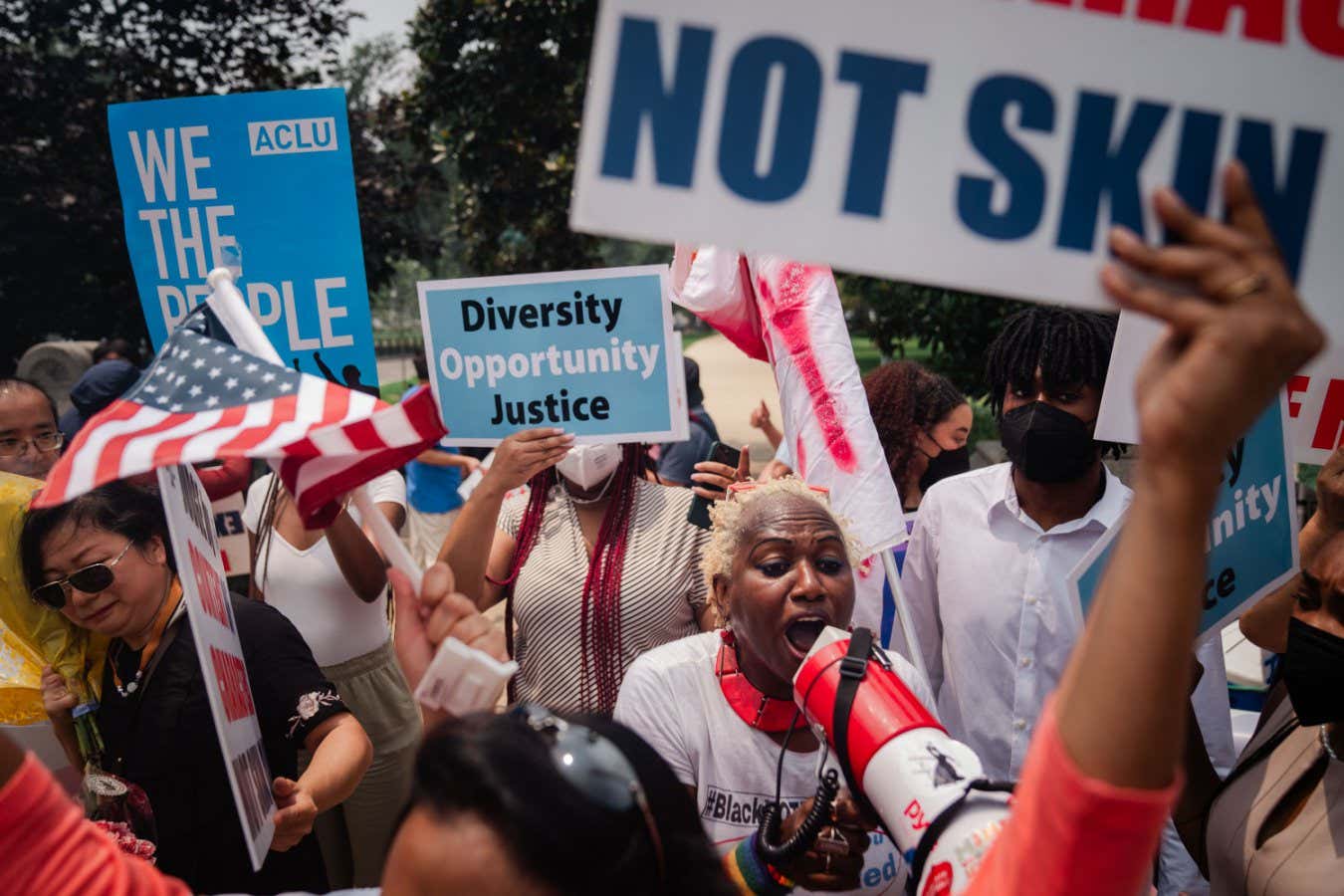 WASHINGTON, DC - JUNE 29: Pro Affirmative Action supporters and and counter protestors shout at each outside of the Supreme Court of the United States on Thursday, June 29, 2023 in Washington, DC. In a 6-3 vote, Supreme Court Justices ruled that race-conscious admissions programs at Harvard and the University of North Carolina are unconstitutional, setting precedent for affirmative action in other universities and colleges. (Kent Nishimura / Los Angeles Times via Getty Images)