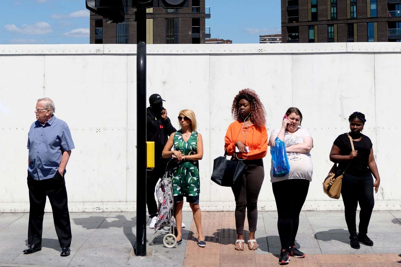 People waiting at traffic lights Description People waiting at traffic lights. Lewisham, London, England, UK